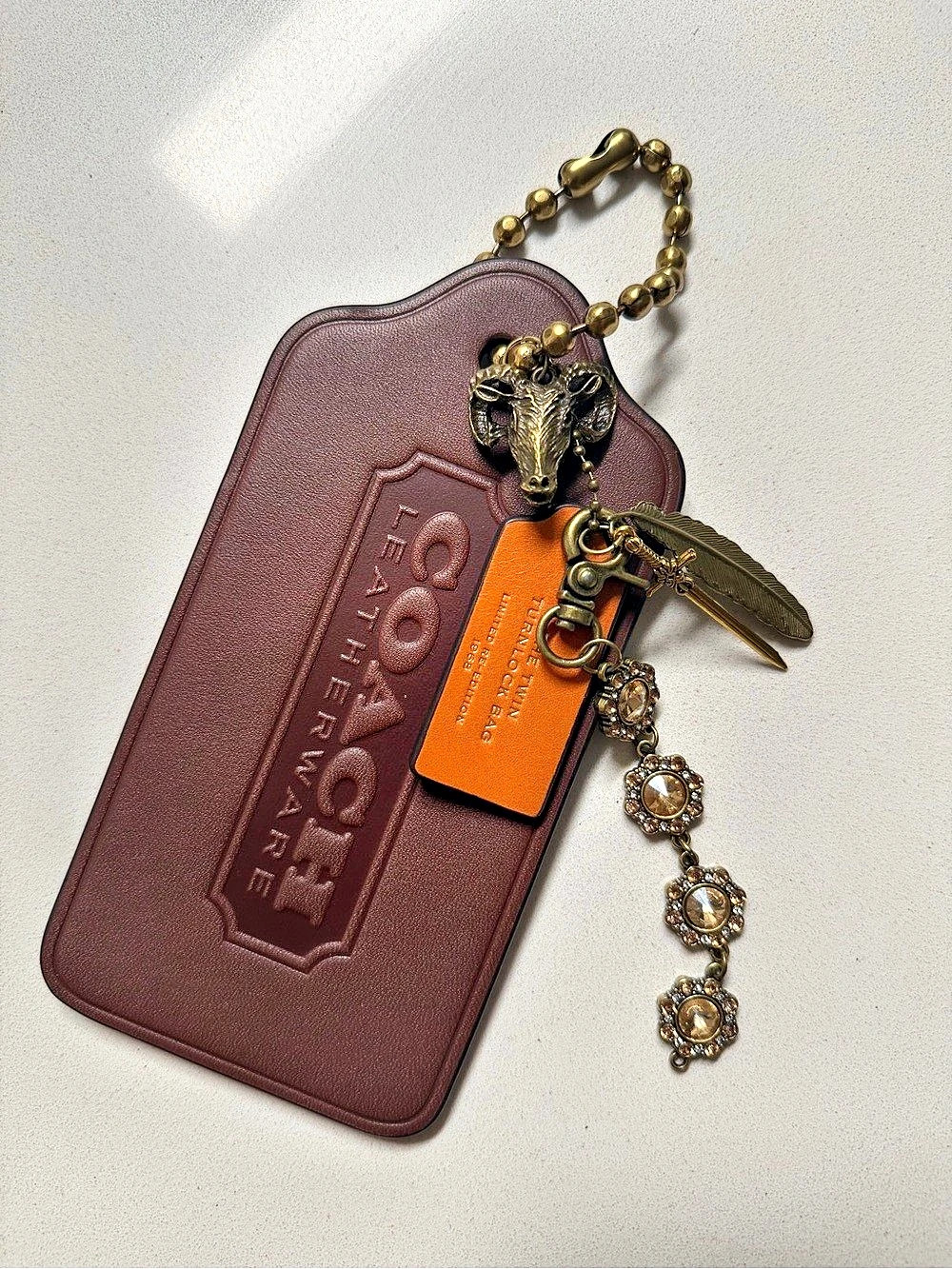 Remade Coach Cluster Charm